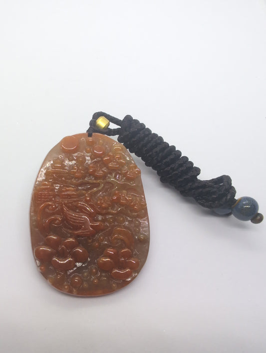 Red jadeite pendant