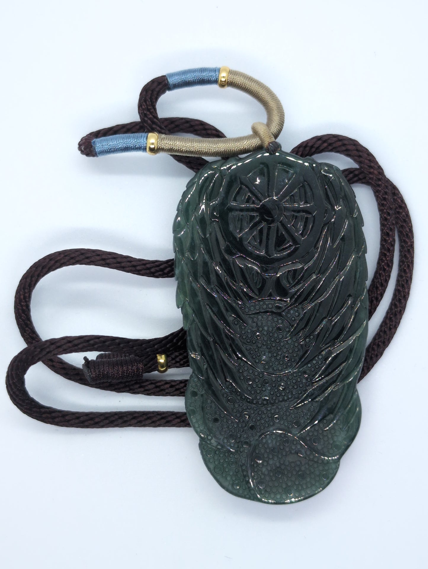 Dark translucent green jadeite pendant